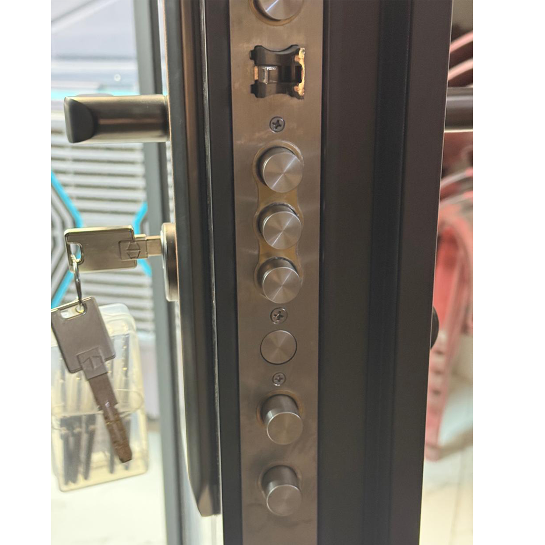 Thumbnail image of grey door with some red leaves around, front view